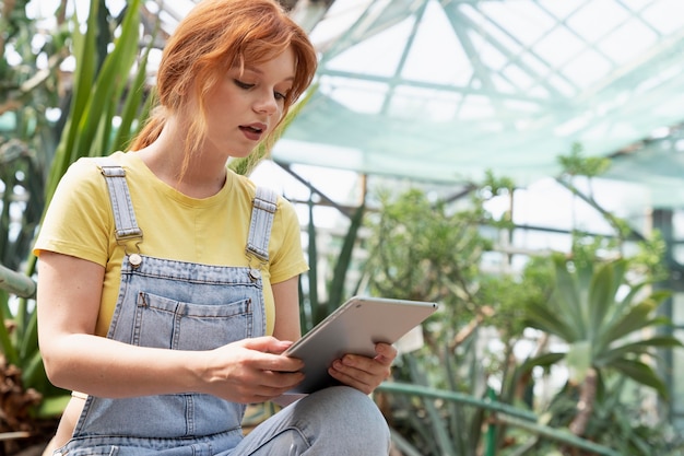 Nature lover working in a greenhouse