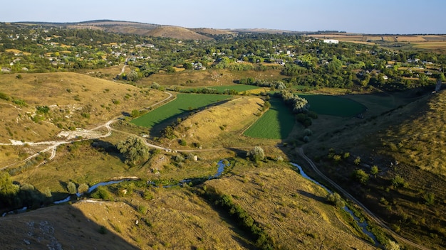Nature of Moldova, vale with flowing river, slopes with sparse vegetation