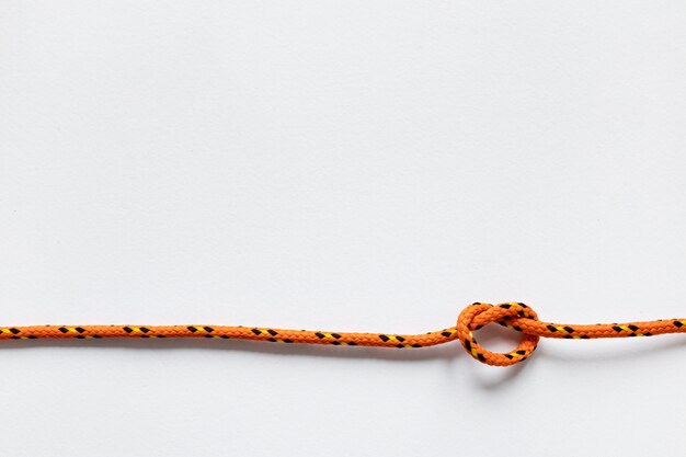 Nautical orange rope knot copy space