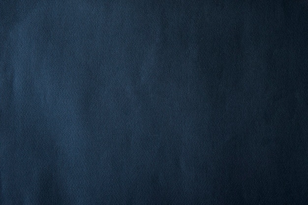 Темно-синий гладкий текстурированный бумажный фон
