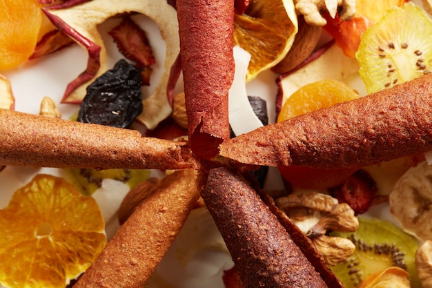 Free photo neatly stacked fruit lozenge different colors and nuts