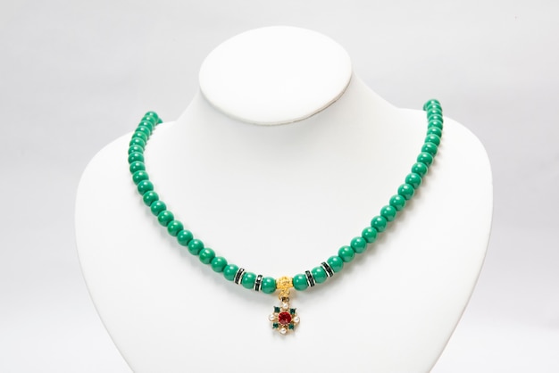 Necklace with green emerald stones.