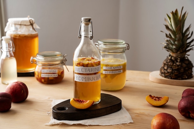 Nectarine kombucha  bottle on table