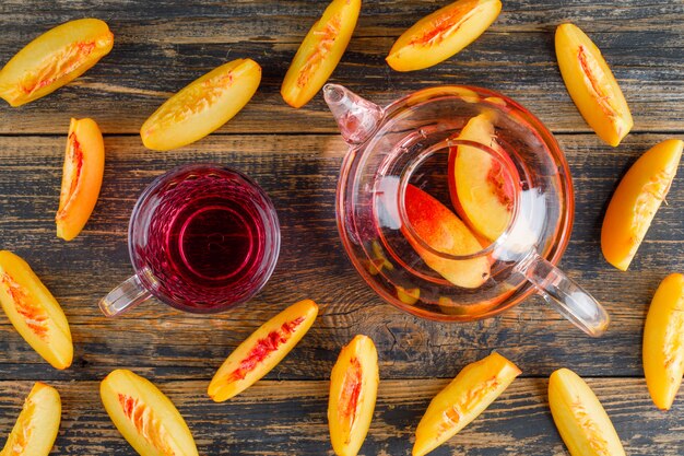 Nectarines with cold drink flat lay on a wooden table