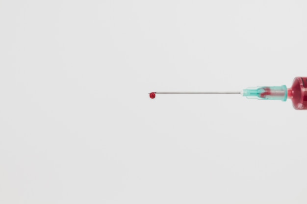 Needle with drop of blood