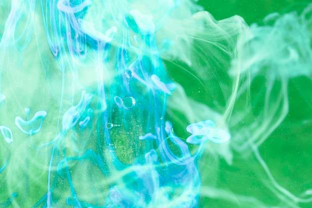 Neon blue smoke on green screen
