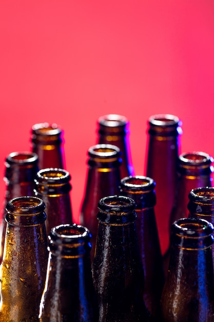 Neon colored beer bottles. Close up on bright