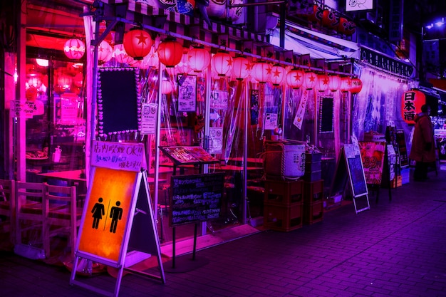 Neon light bathroom sign at night