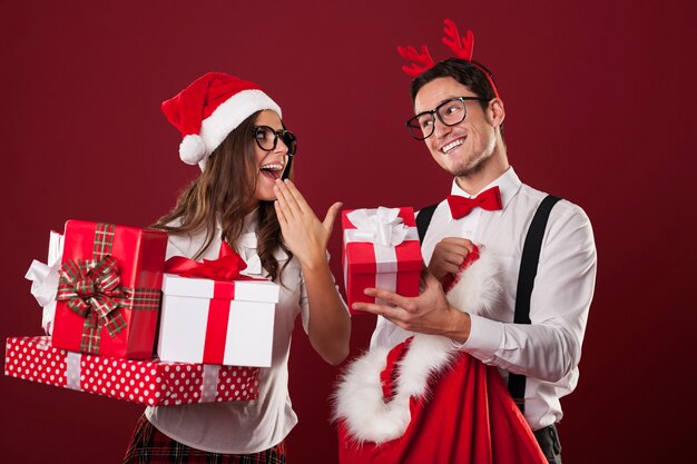 Nerd couple exchanging christmas gifts