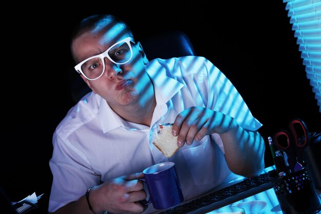 Nerd surfing internet at night time