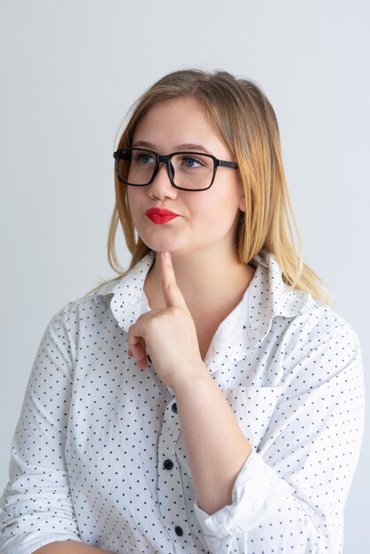 Nerdy student listening to speaker