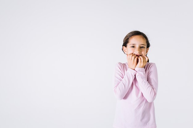 Nervous girl biting nails