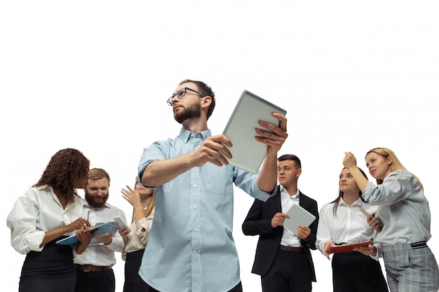 Nervous tensioned investors analyzing crisis stock market with charts on screen of their gadgets