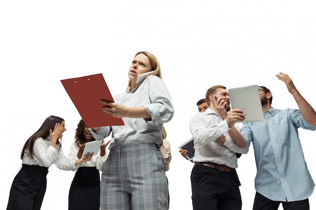 Nervous tensioned investors analyzing crisis stock market with charts on screen of their gadgets