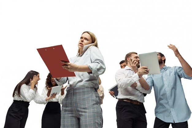 Nervous tensioned investors analyzing crisis stock market with charts on screen of their gadgets