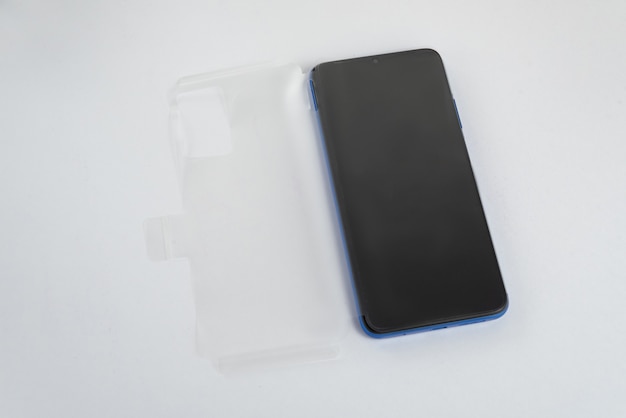 New cellphone with transparent cover over isolated white background