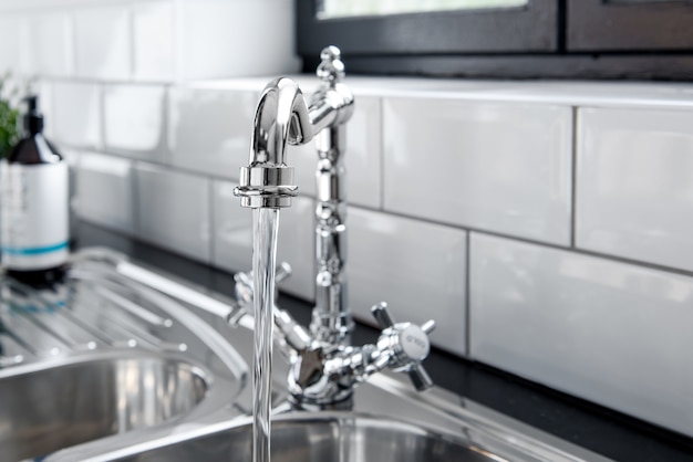 New and  modern steel faucet in the kitchen