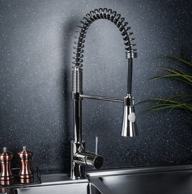 New and modern steel faucet in the kitchen