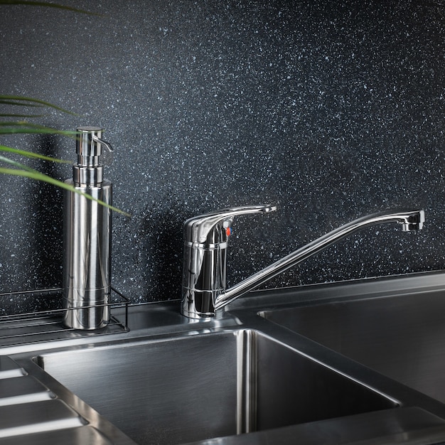 New and  modern steel faucet in the kitchen