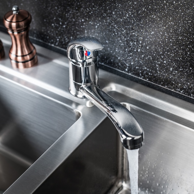 New and modern steel faucet in the kitchen