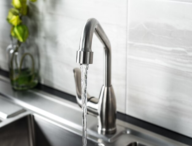 New and modern steel faucet in the kitchen