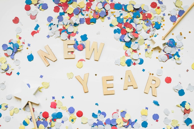 New year background with colorful confetti and letters