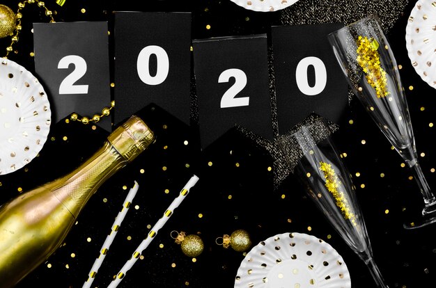 New year celebration 2020 champagne and glitter