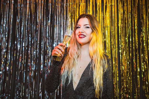 New year celebration concept with woman drinking champagne