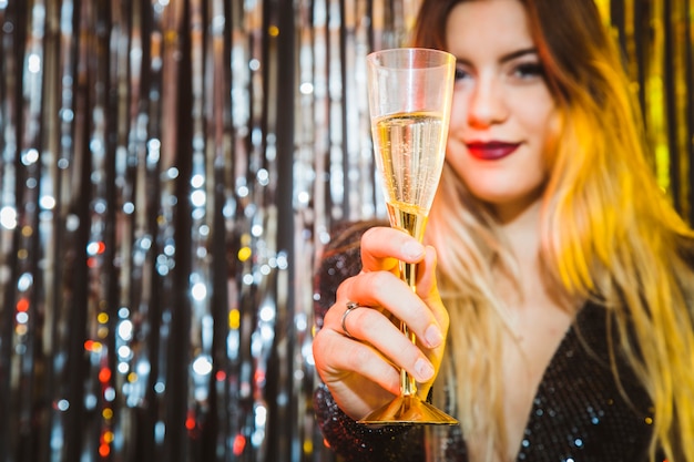 New year celebration concept with woman showing glass