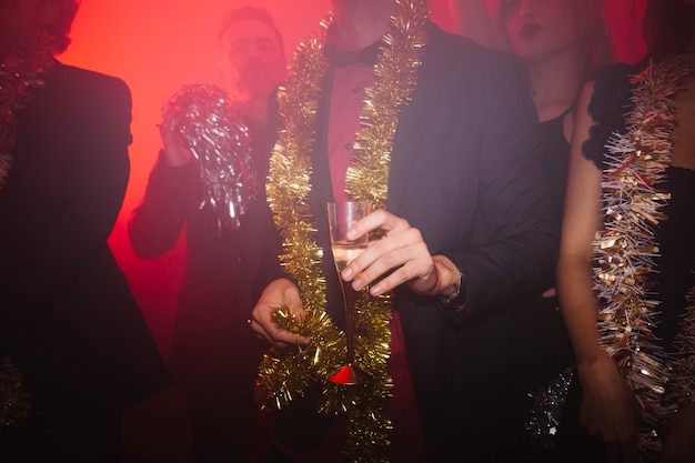 Free photo new year club party with man holding glass