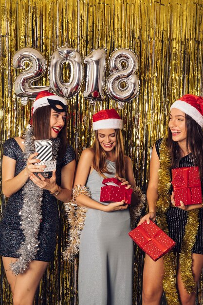 New year concept with friends holding presents