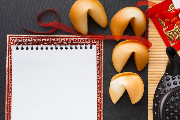 Free photo new year fortune cookies empty notepad