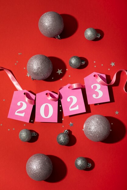 New year globes and pink ribbon top view