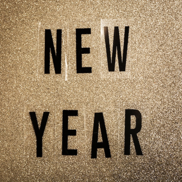 Free photo new year lettering on noise sepia background