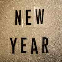 Free photo new year lettering on noise sepia background