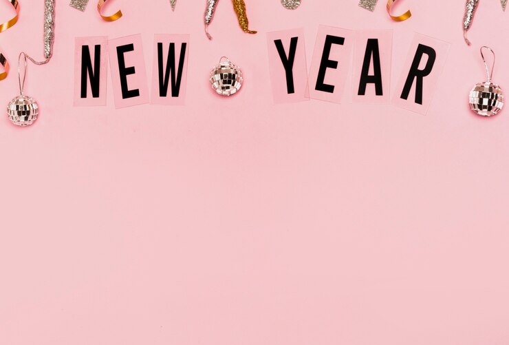 Free Photo new year lettering with copy space pink background