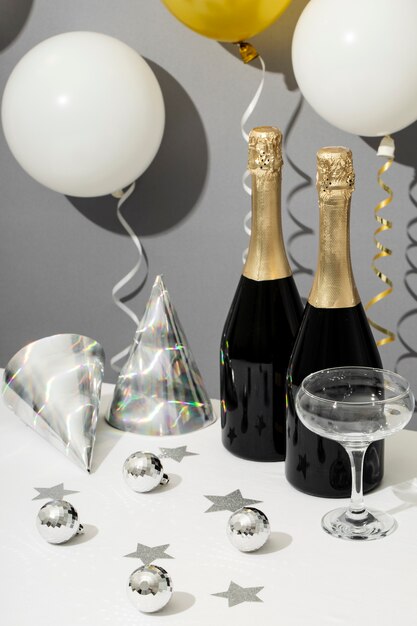 New year party arrangement with champagne bottle