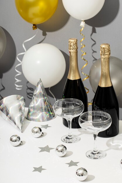 New year party arrangement with champagne bottle