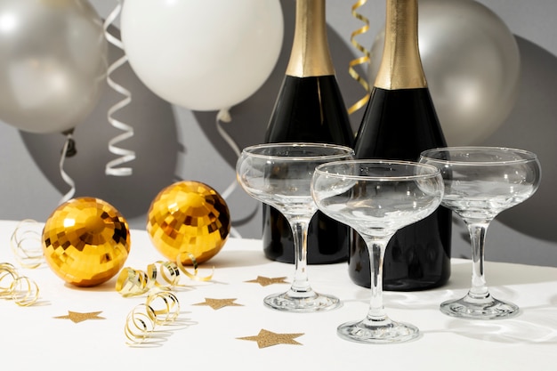 New year party arrangement with champagne bottle