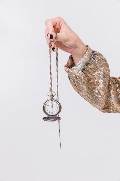 New year party concept with girl holding clock