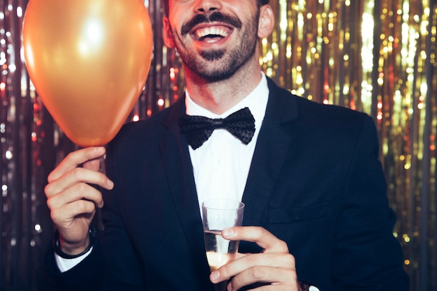 New year party concept with man holding balloon