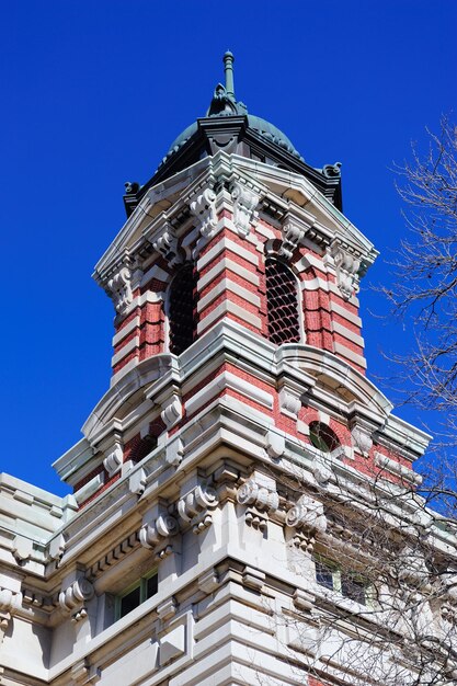 New York City Ellis Island Great Hall with blue clear sky