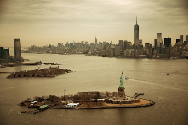 New York City Manhattan aerial view with downtown skyscrapers and statue of liberty