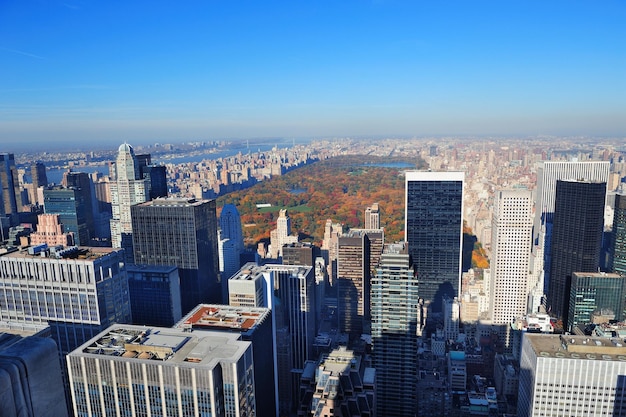 New York City skyscrapers in midtown Manhattan aerial panorama view in the day with Central Park and colorful foliage in Autumn.