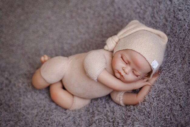 Premium Photo Newborn Baby Mannequin Close Up For Practicing In Newborn Photography