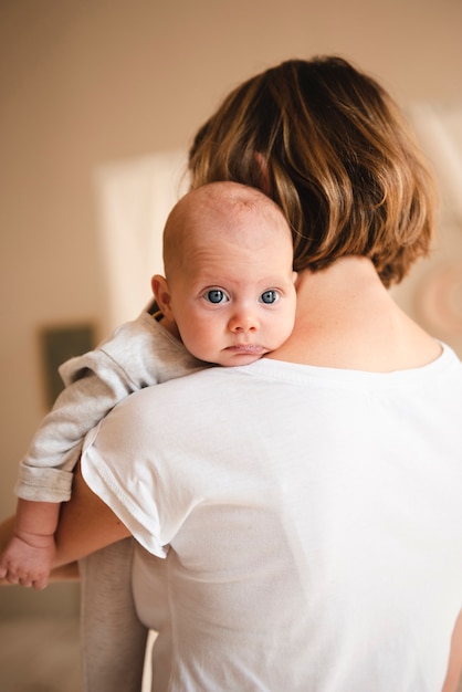 Newborn in the embrace of mother