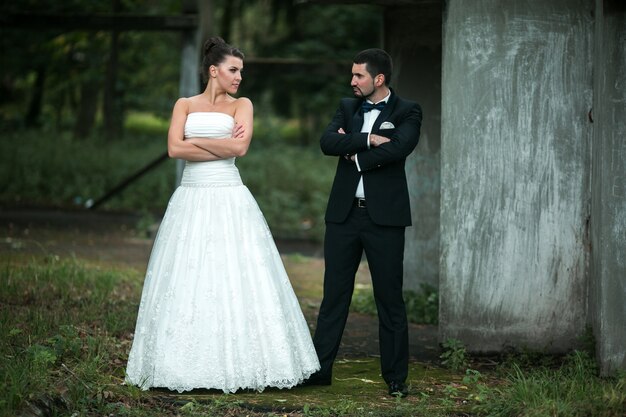 Newly married couple with arms crossed