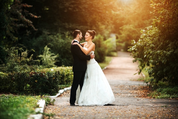 Newlywed couple looking into each other's eyes