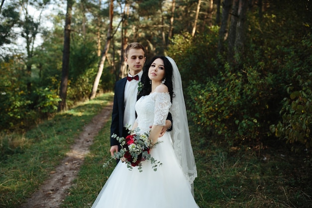 Newlywed couple in woods