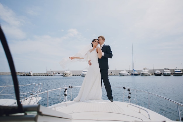 Newlyweds over a boat